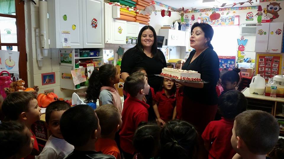 The Director Giving a Child Cake for Birthday